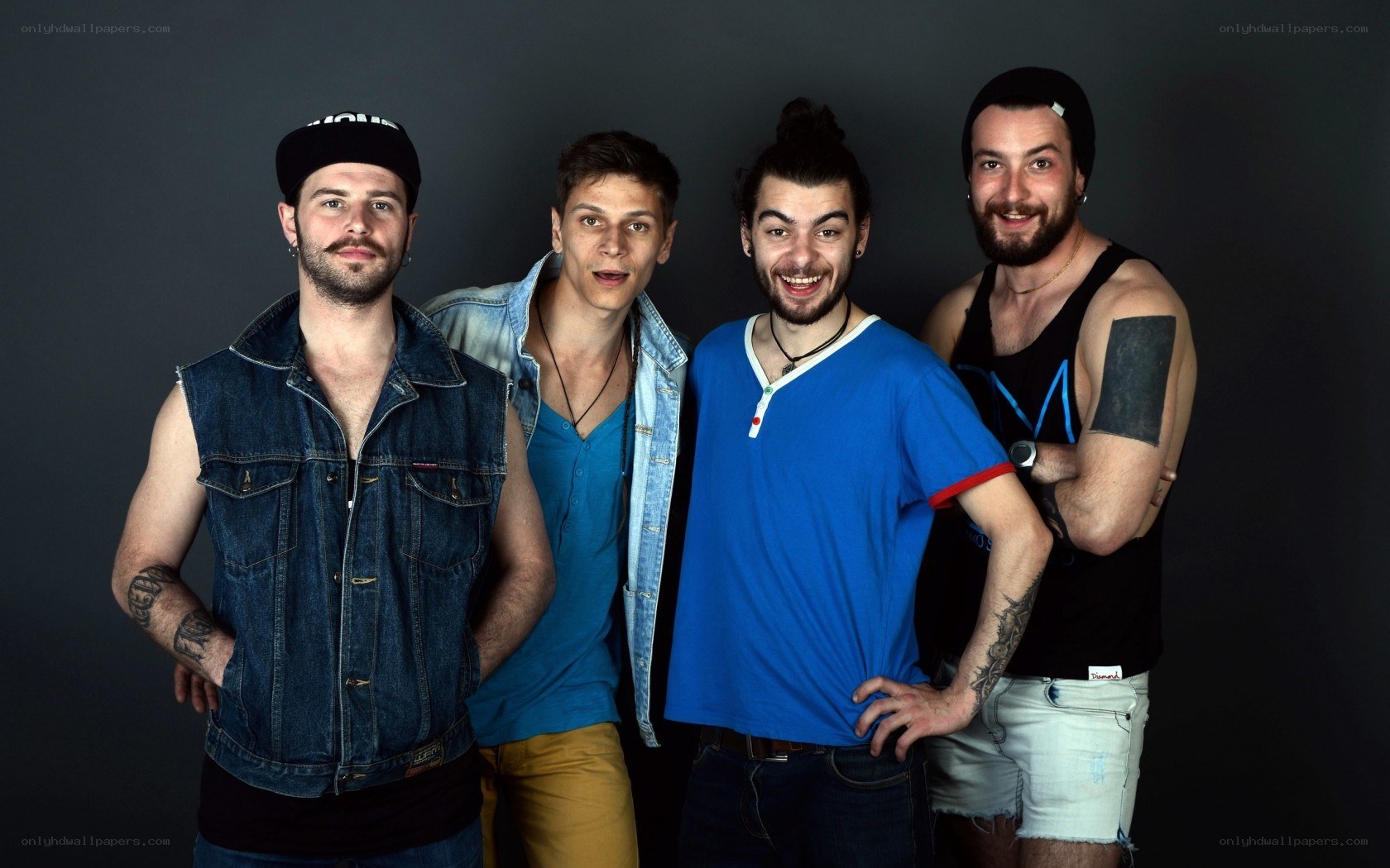 four men posing together