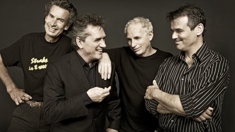 Four Men Posing Together — Black, Friendly