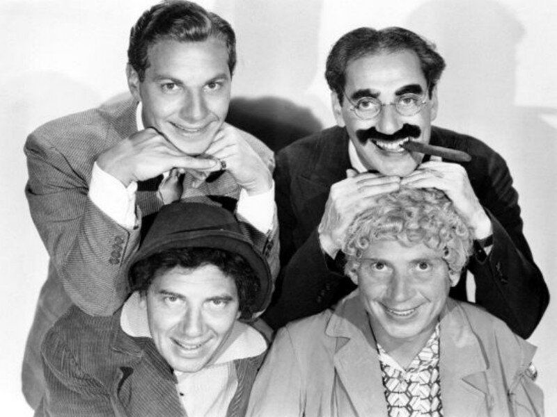Four Men Posing Together — Black