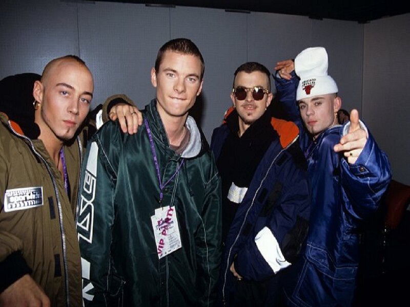 Four Men Posing Together — Blue