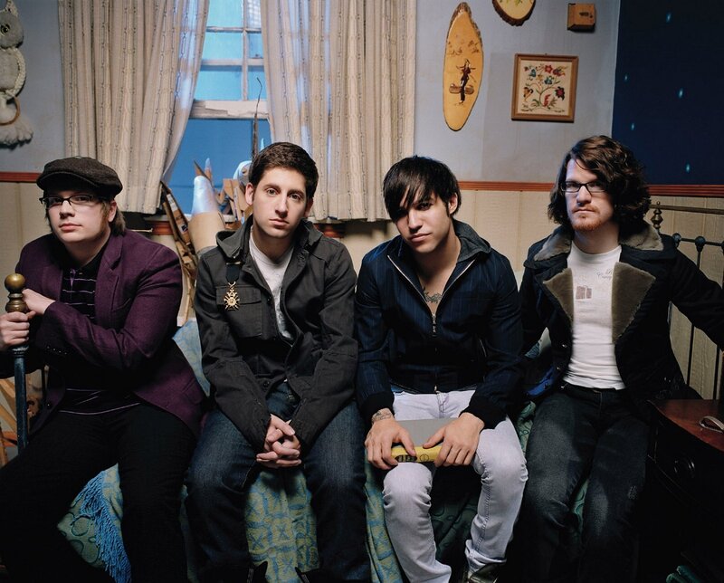 Four Men Sitting on a Couch — Blue