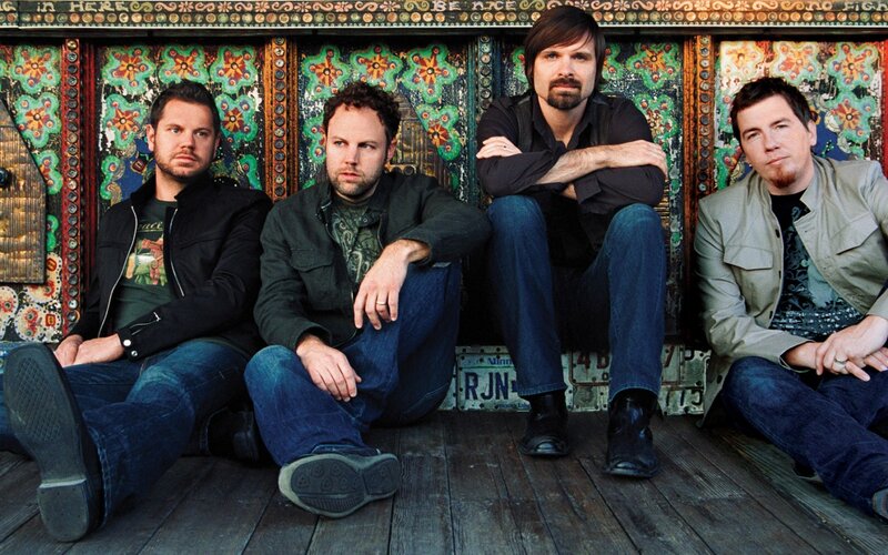 Four Men Sitting on Floor — Blue
