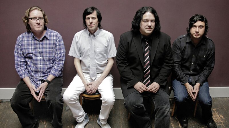 Four Men Sitting
