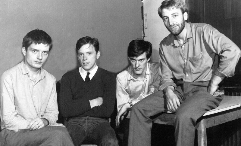 Four Men Sitting Together — Black