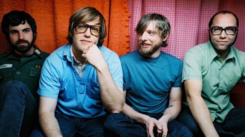 Four Men Sitting Together — Orange