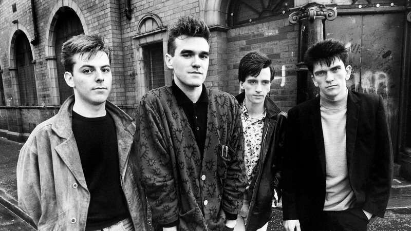 Four Men Standing — Black, Serious, Photograph, Building, Brick Wall