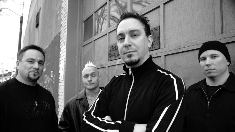 Four Men Standing — Black, Serious, Photograph, Building