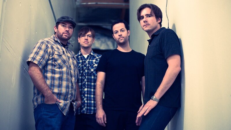 Four Men Standing — Blue, Neutral, Photograph, Wall