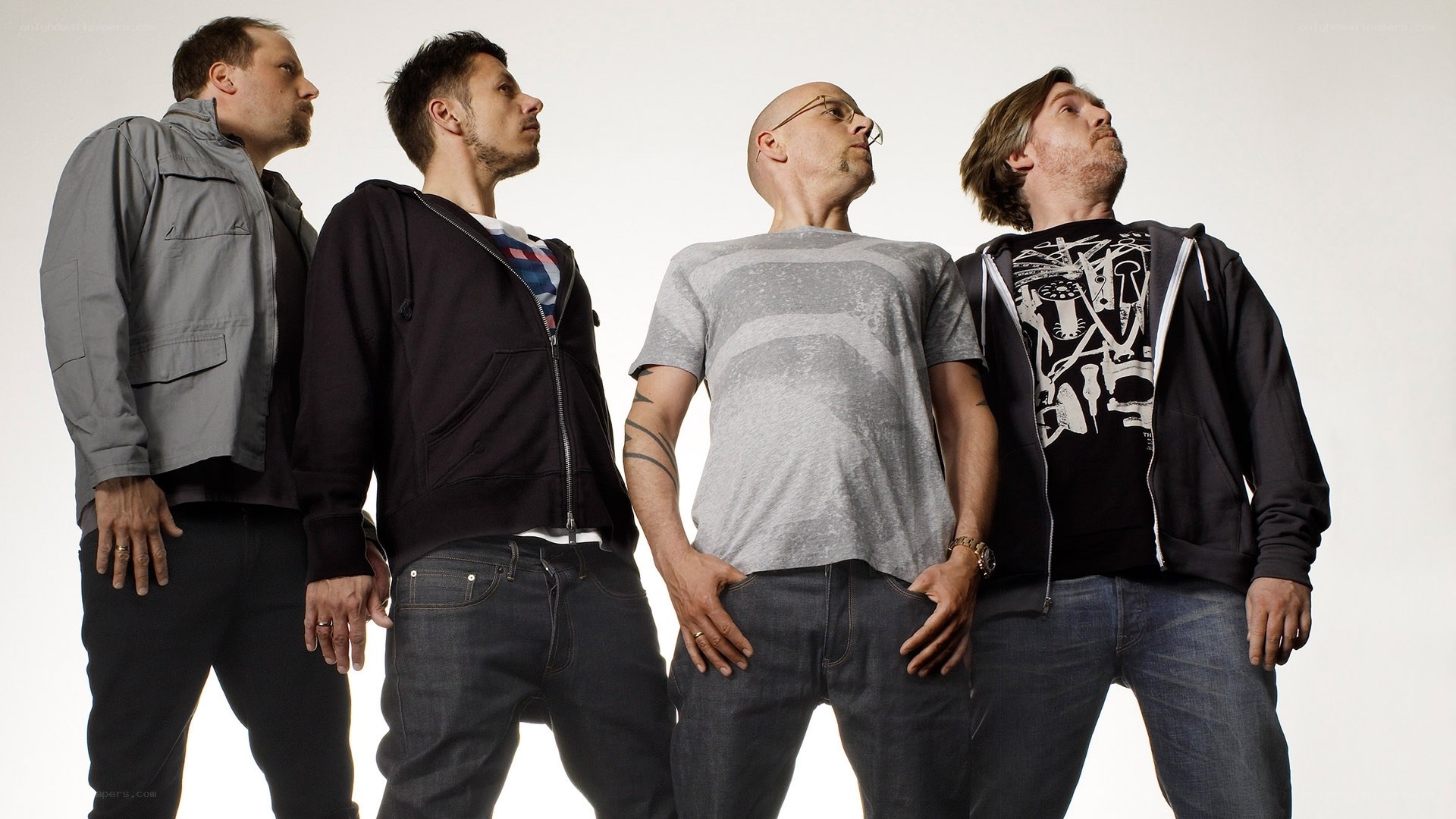 four men standing in a row