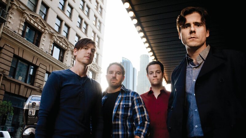 Four Men Standing on Street