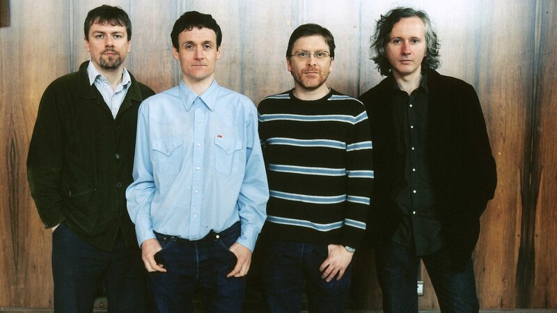 four men standing together