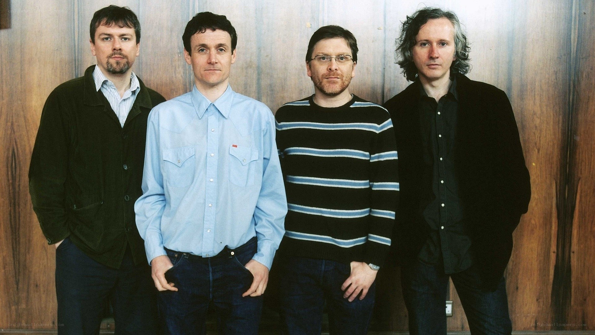 four men standing together