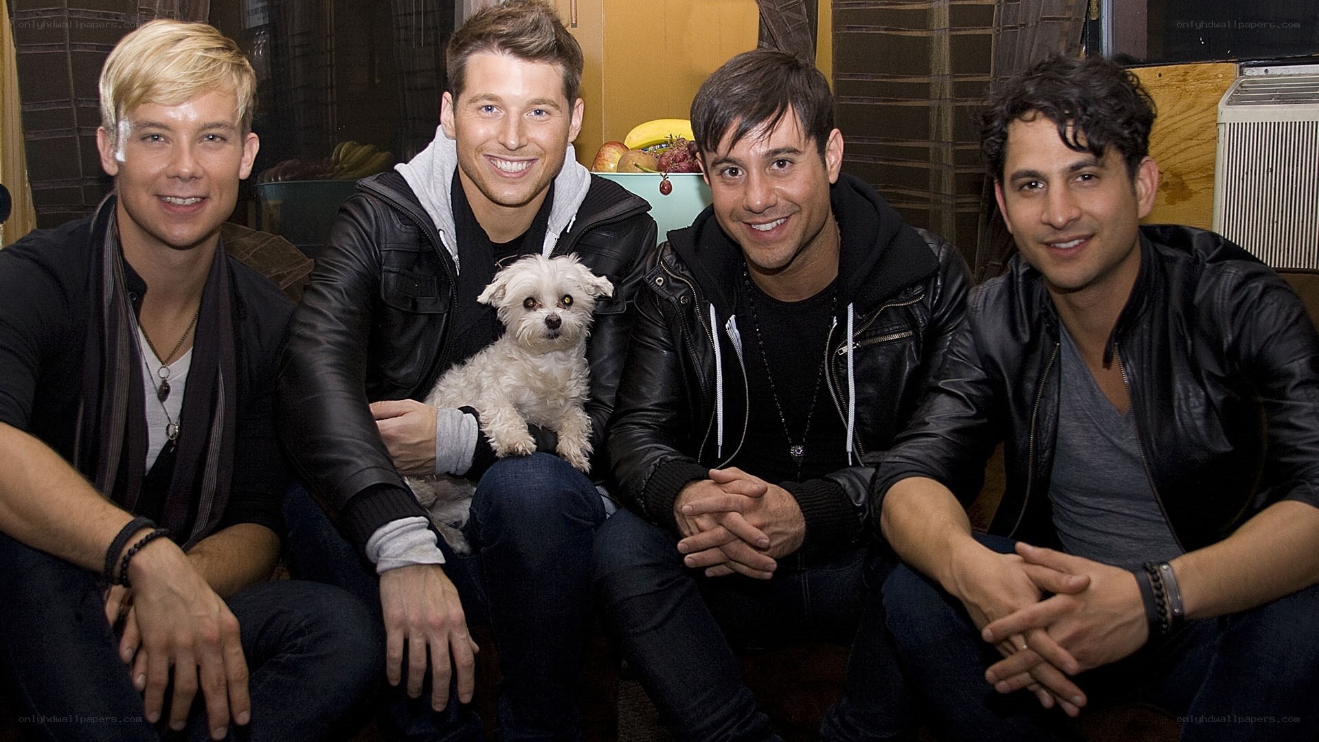 Four men with a dog