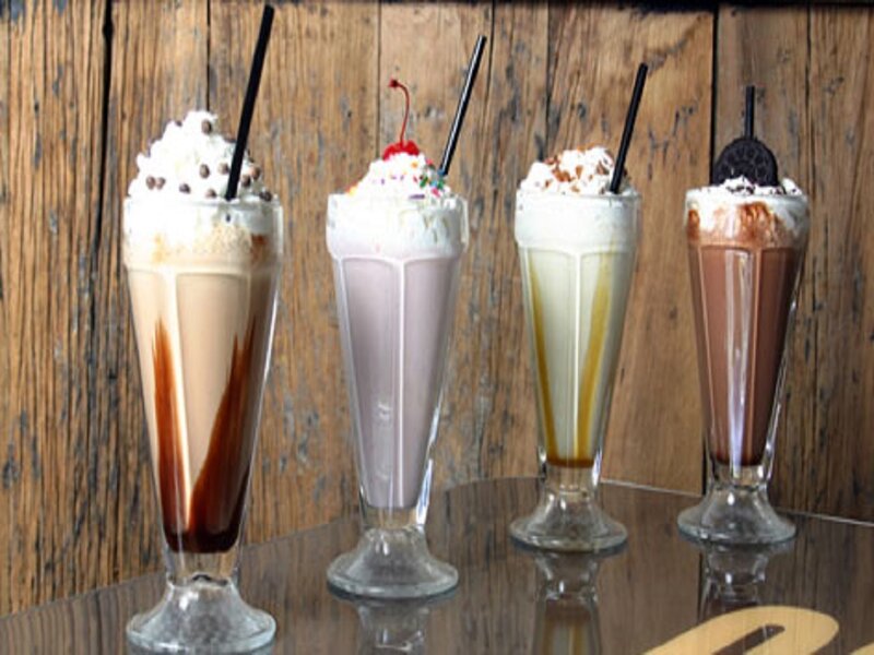 Four Milkshakes in Glasses — Brown