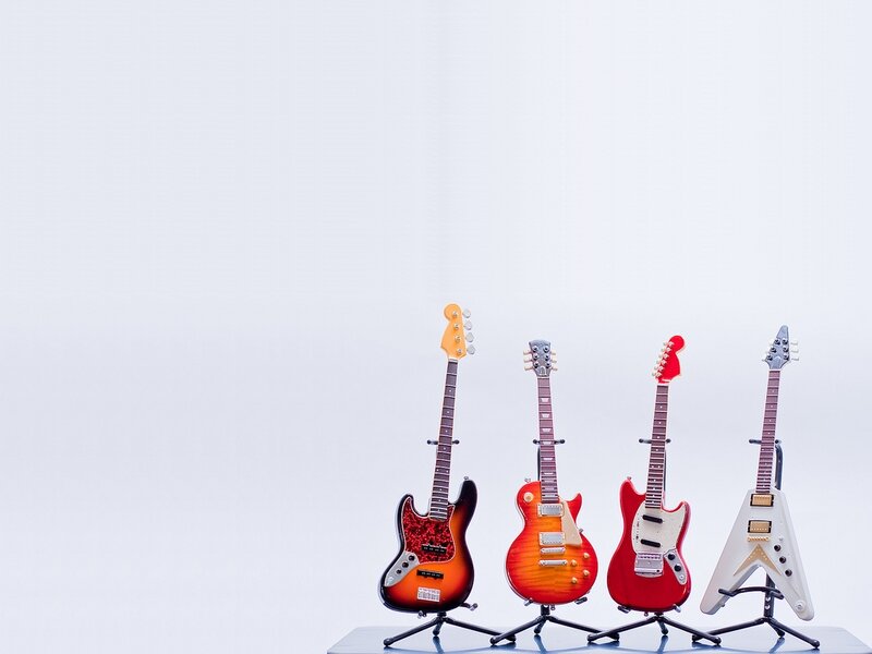 Four Miniature Guitars