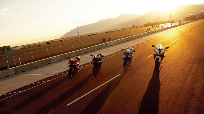 Four Motorcycles on Track — Orange