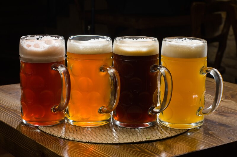 Four mugs of beer on a table