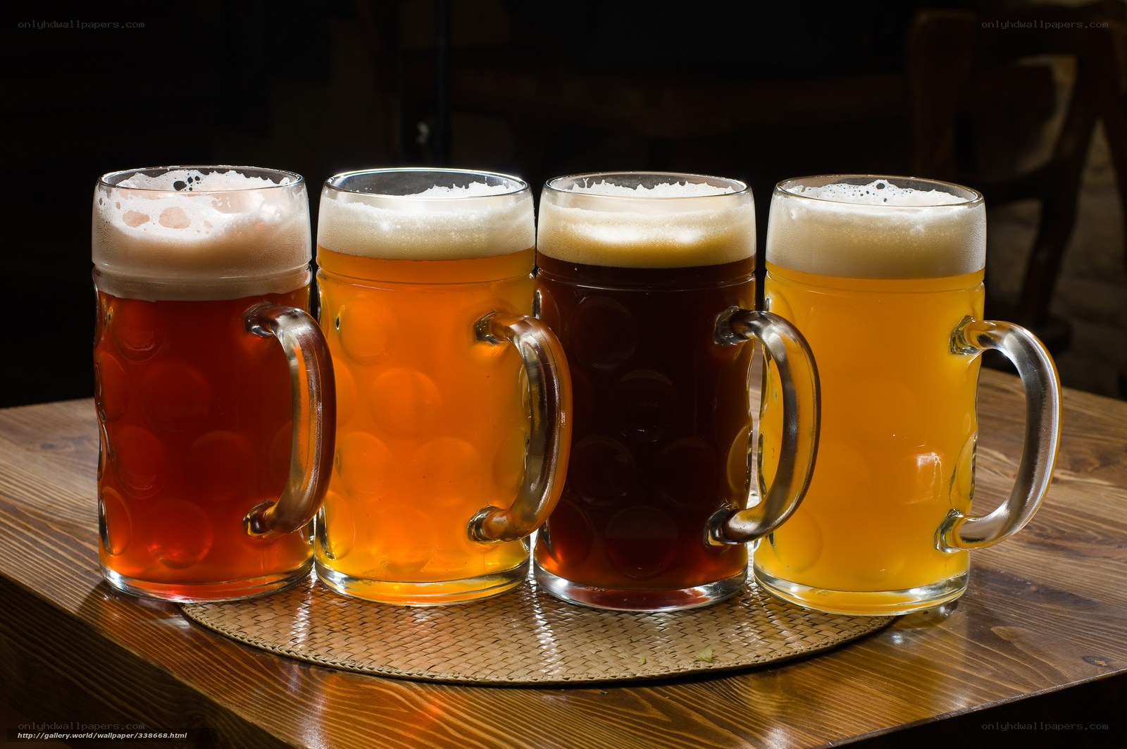 Four mugs of beer on table