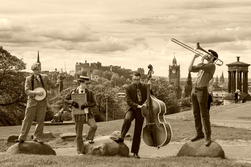 Four Musicians on Rocks