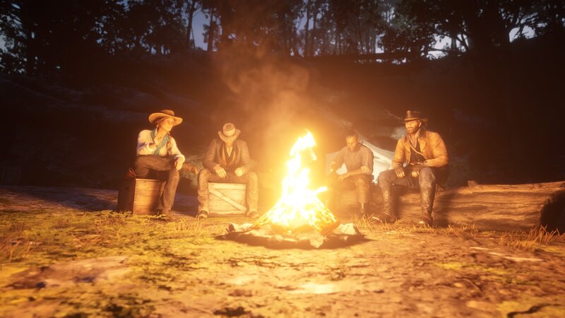 Four People Around Campfire