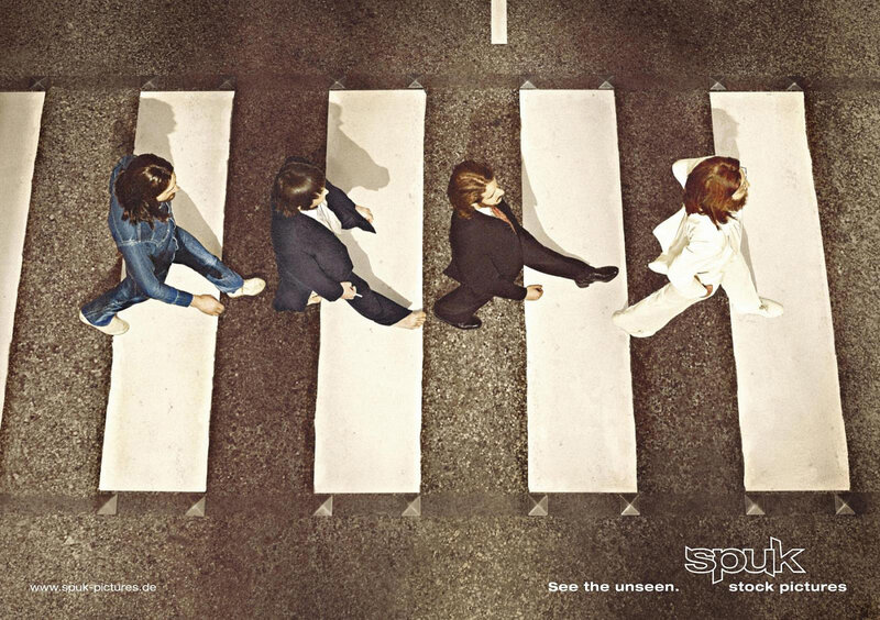 Four People Crossing Street