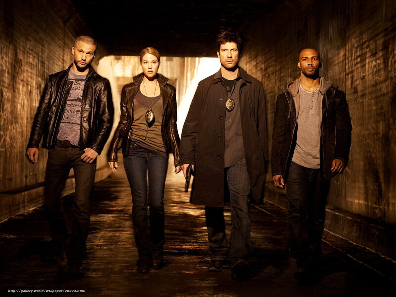 four people in a tunnel