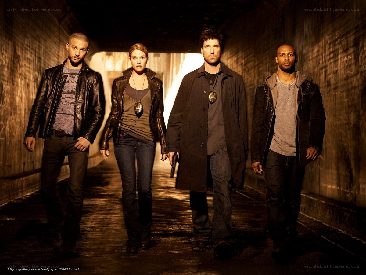 four people in a tunnel