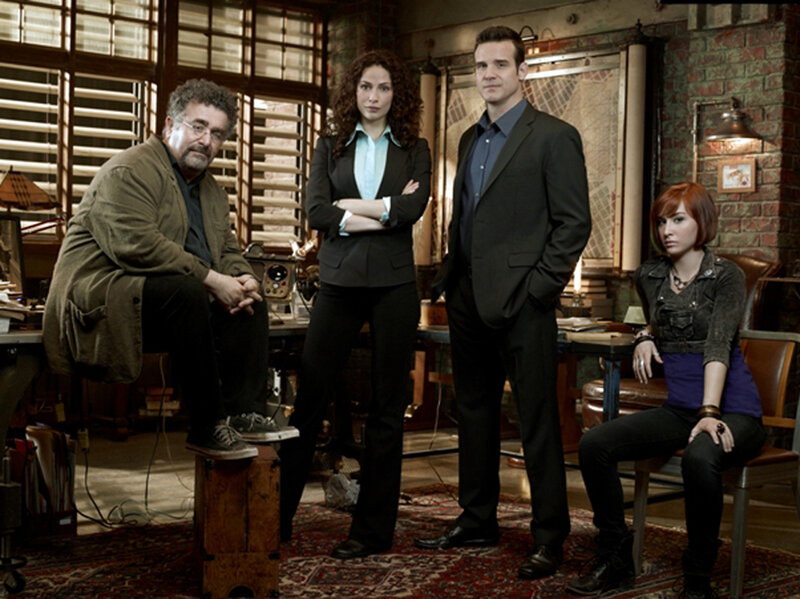 four people in a workshop