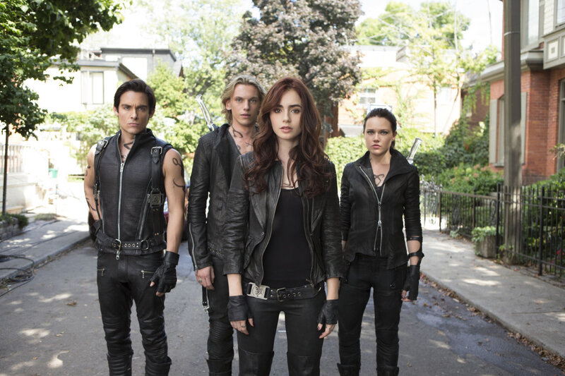 Four People in Black Leather