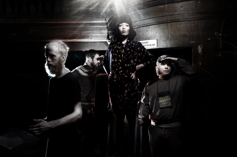 Four People in Dark Room