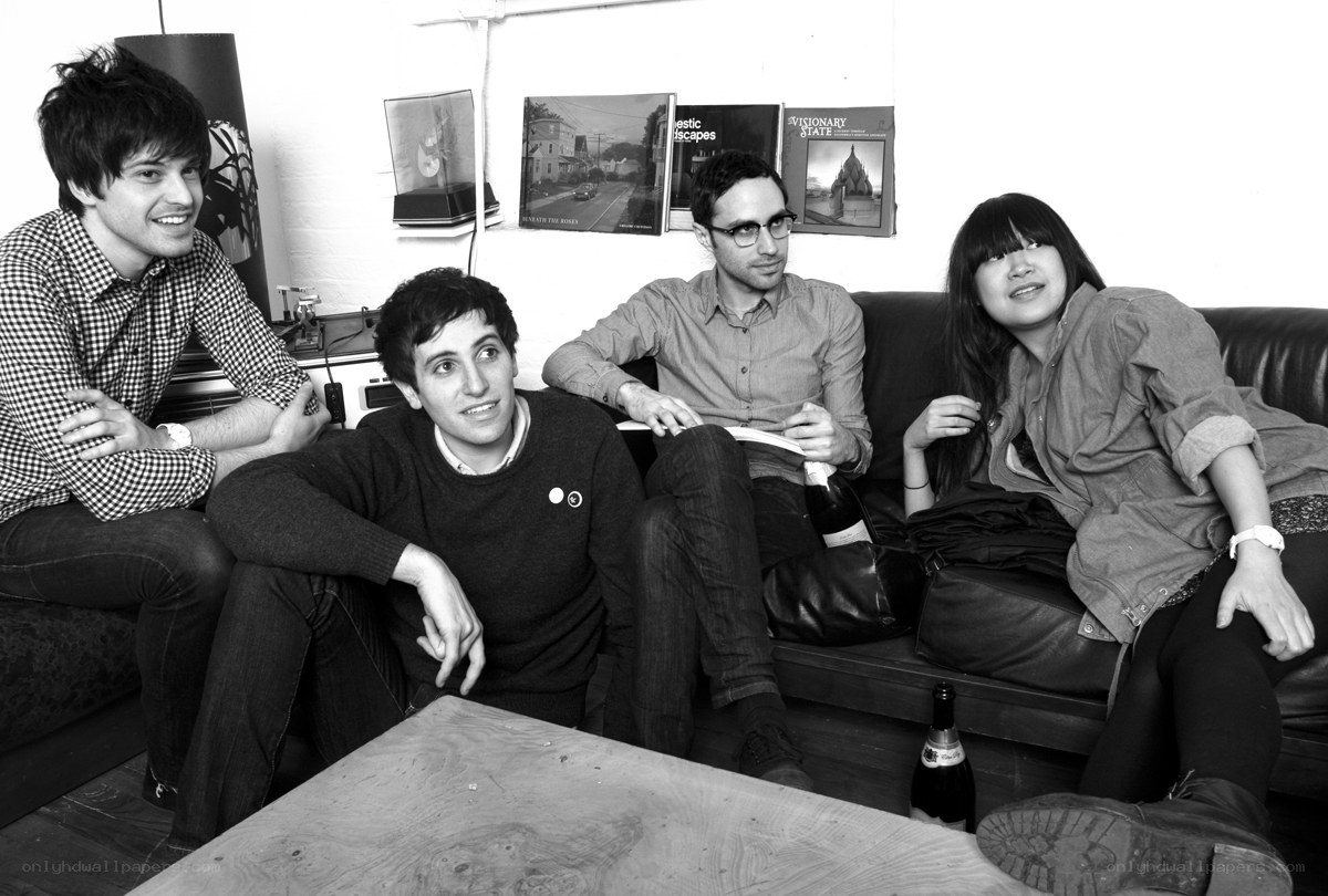 four people on a couch