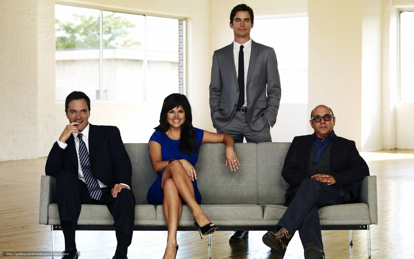 four people on a couch