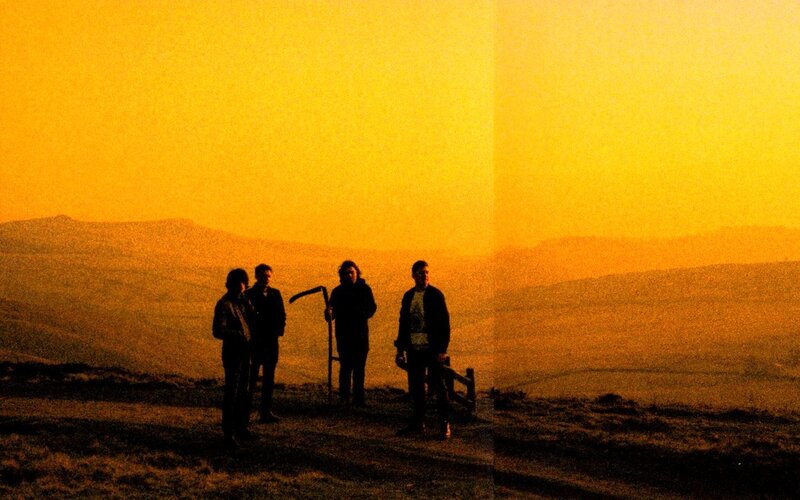 Four People on a Hill