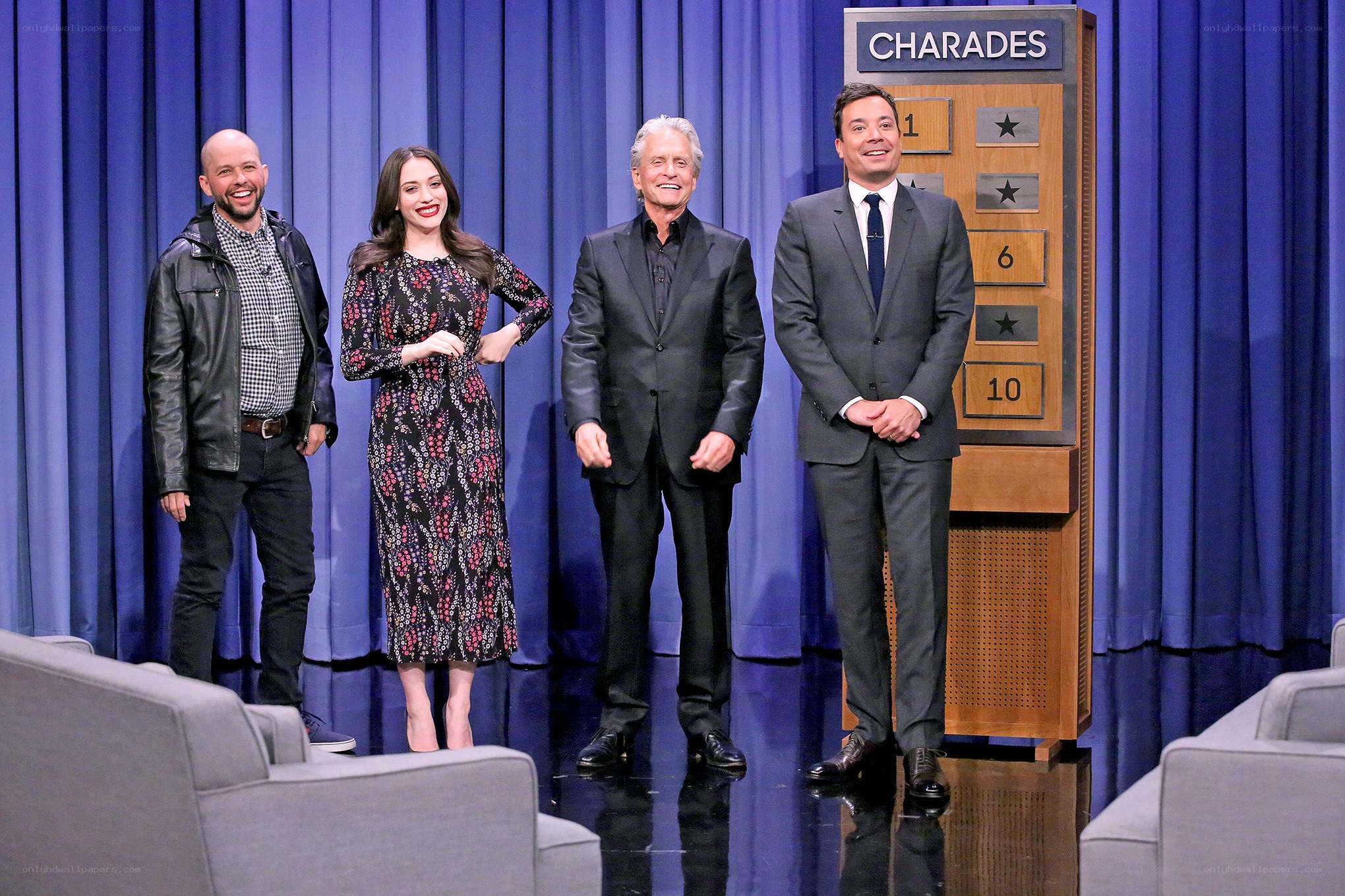 Four people on a talk show set