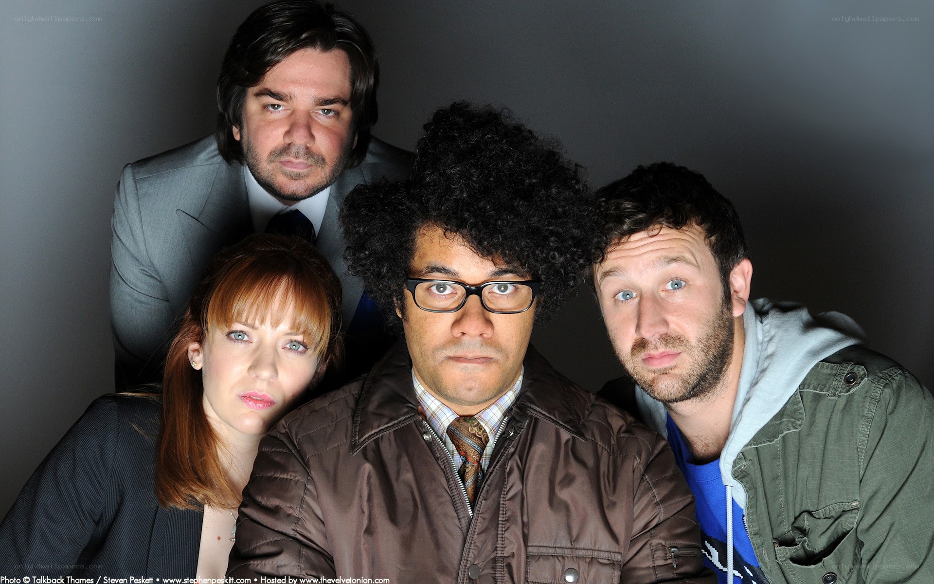 four people posing for a photo