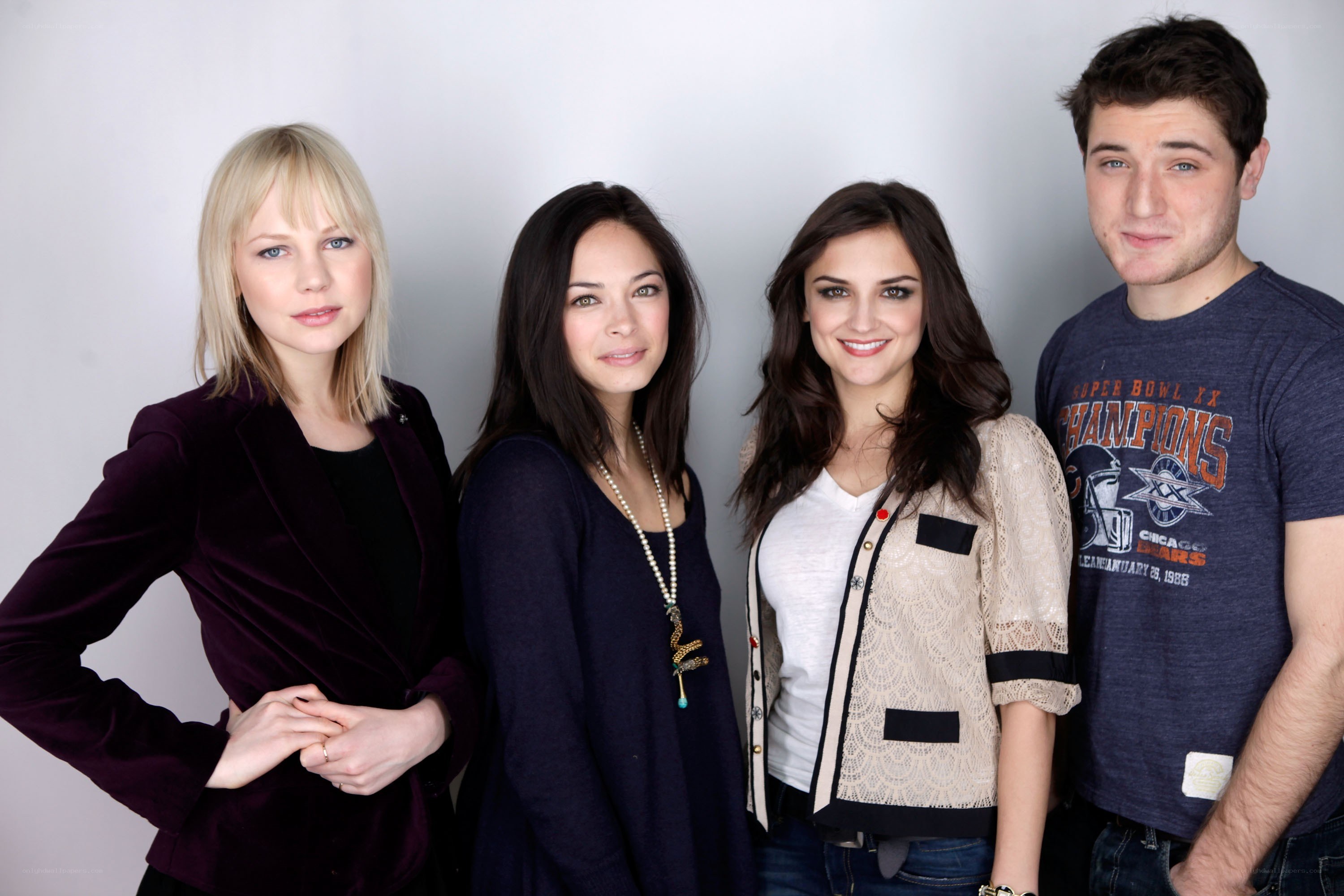four people posing for a photo