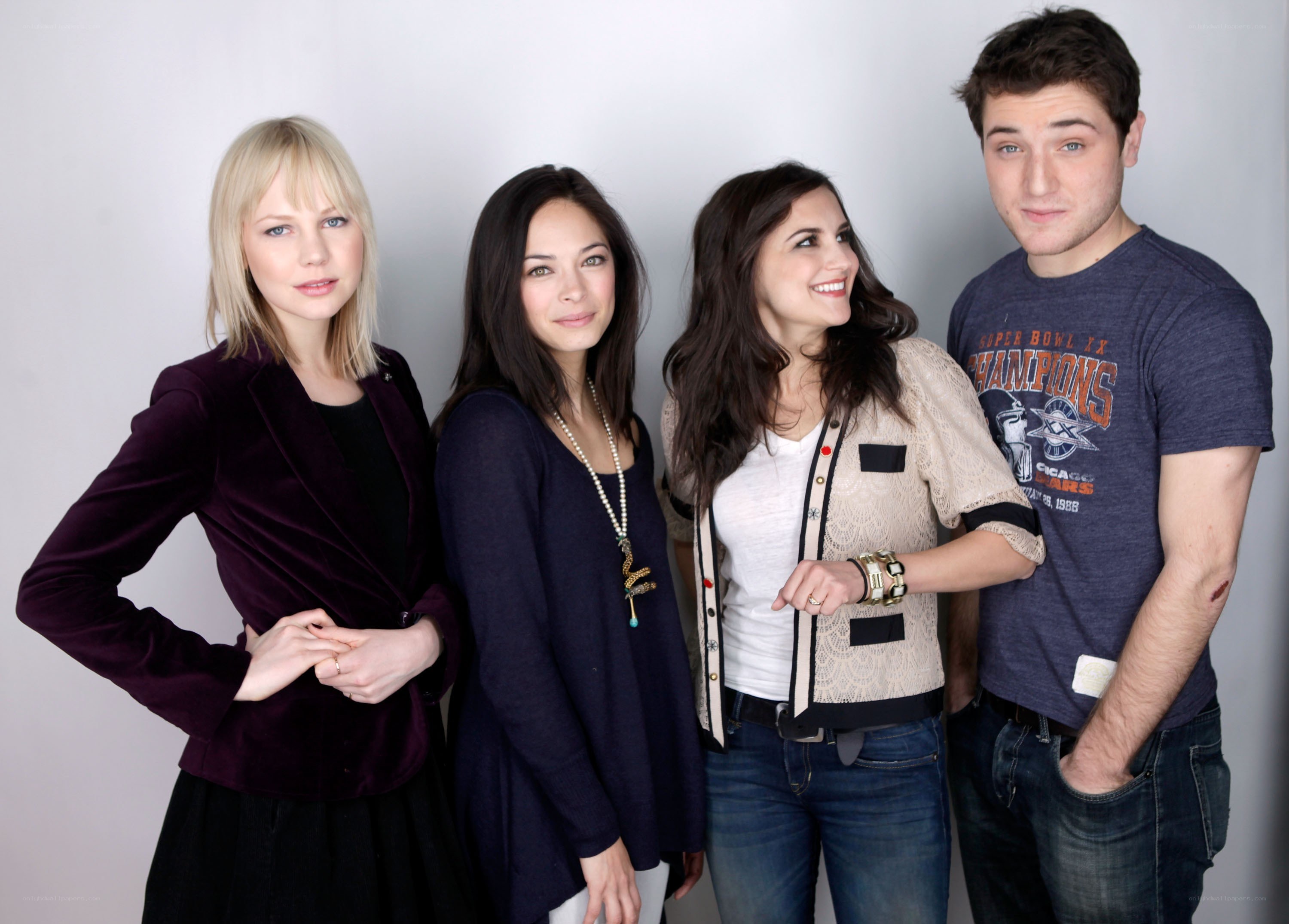 four people posing for a photo