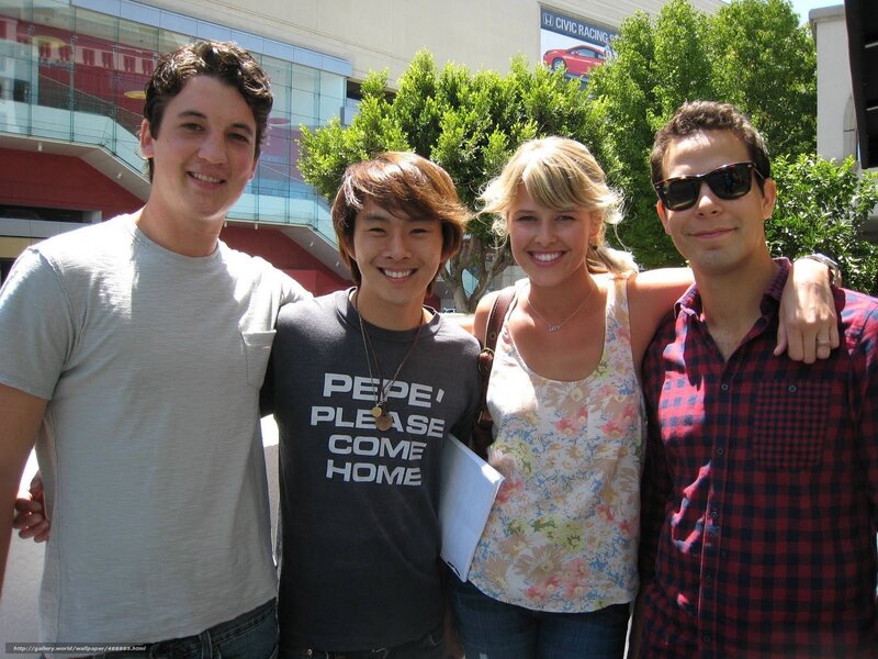 four people posing together