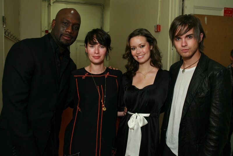 Four people posing together