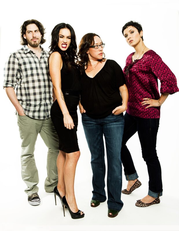 four people posing together