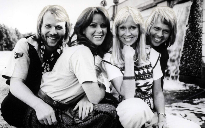 Four People Posing Together — Black, Happy