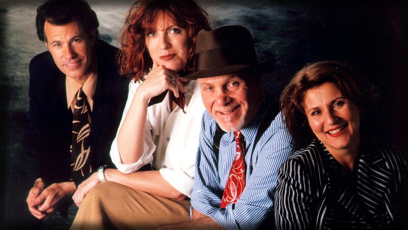 four people posing together
