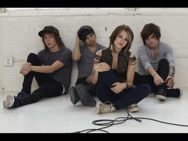 Four People Sitting on Floor