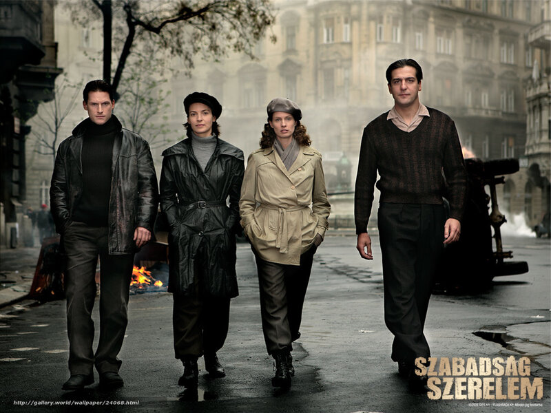 Four people walking in a city