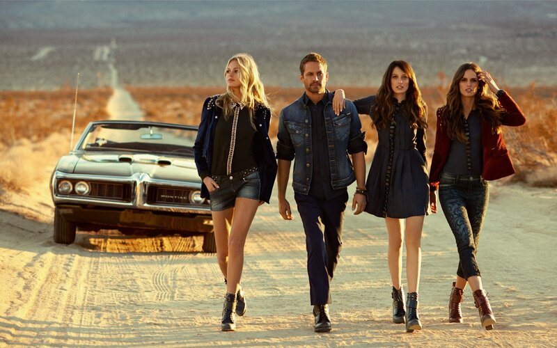 Four People Walking on Road