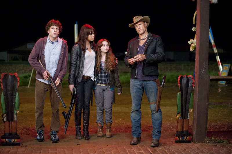 Four people with weapons at night