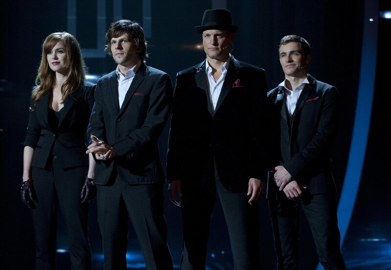 Four Performers on Stage — Black