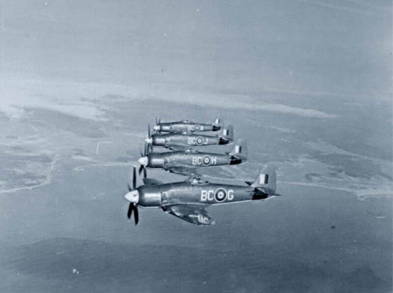 Four Propeller Planes in Formation