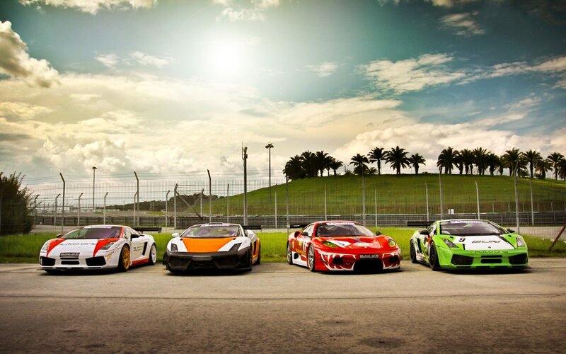 Four race cars on a track