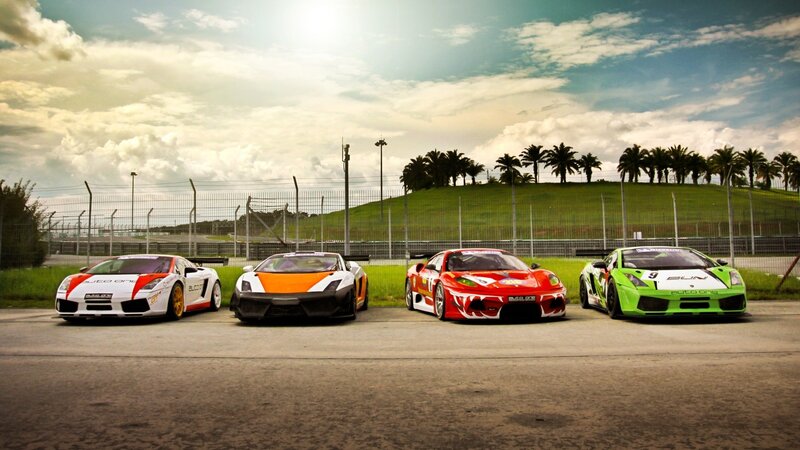 Four race cars on a track